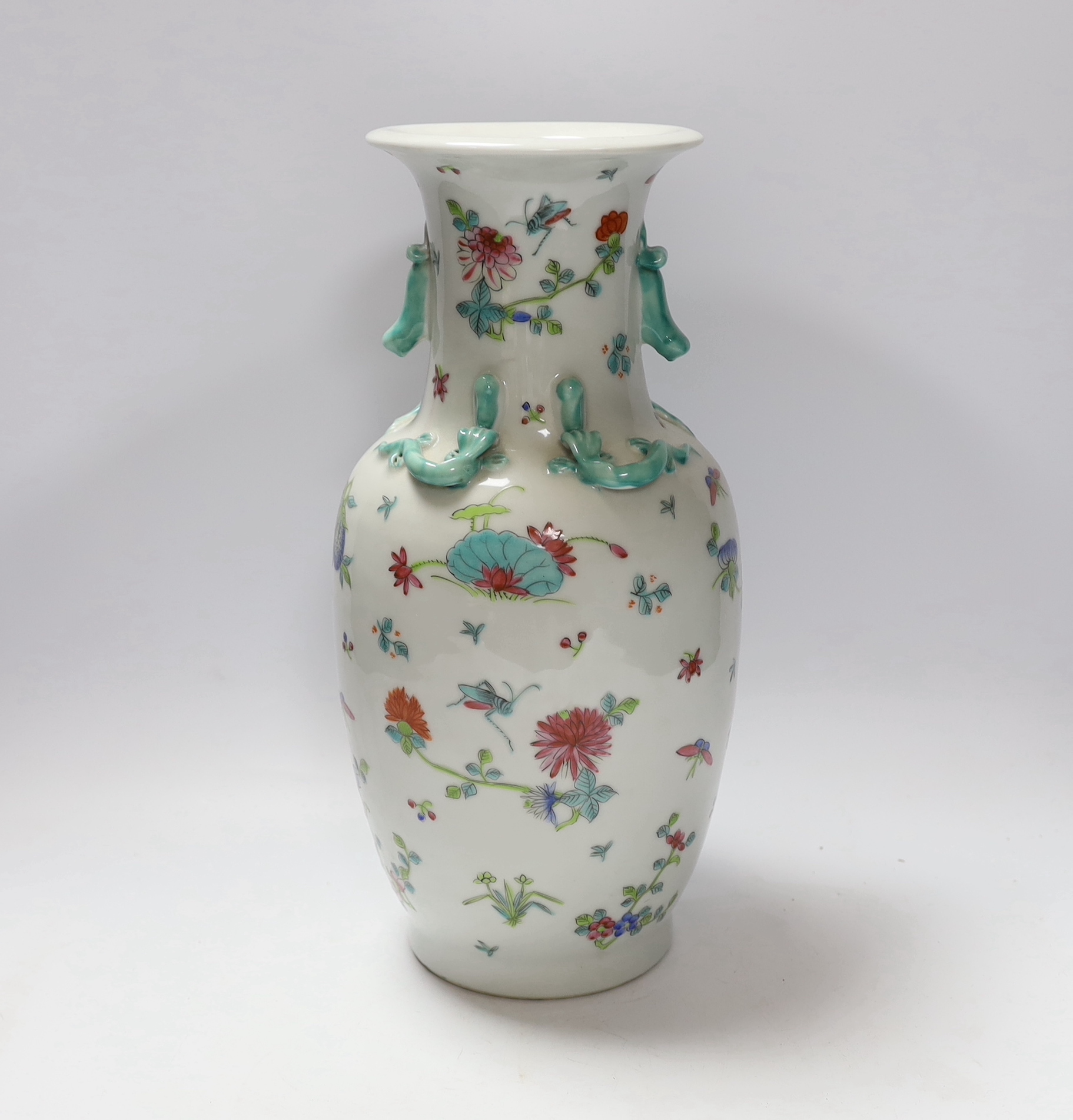 A Chinese famille rose vase, 20th century, with a drilled base, intended to be converted to a lamp, 36cm high